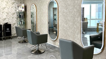 Modern salon interior with chic chairs and mirrors at Rosemarie Beauty Centre, Dubai, AE.