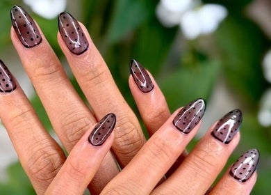 Stylish polka dot nail art at Rosemarie Beauty Centre, Dubai, AE. Perfect blend of elegance and creativity.