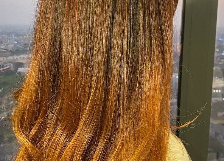 Beautiful hair styling at Sam Studio, Phnom Penh, Phnom Penh, KH with cityscape backdrop.