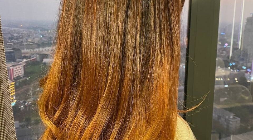 Beautiful hair styling at Sam Studio, Phnom Penh, Phnom Penh, KH with cityscape backdrop.