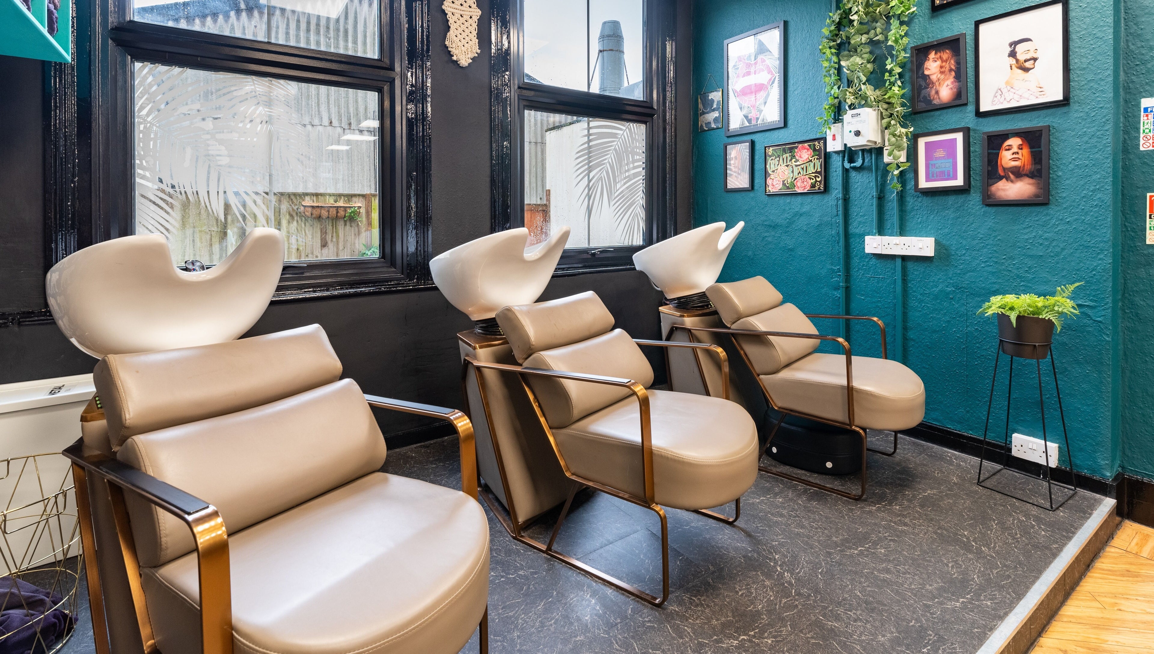 Modern salon chairs at The Knott, Folkestone, England, GB, offering a stylish and relaxing hair washing experience.