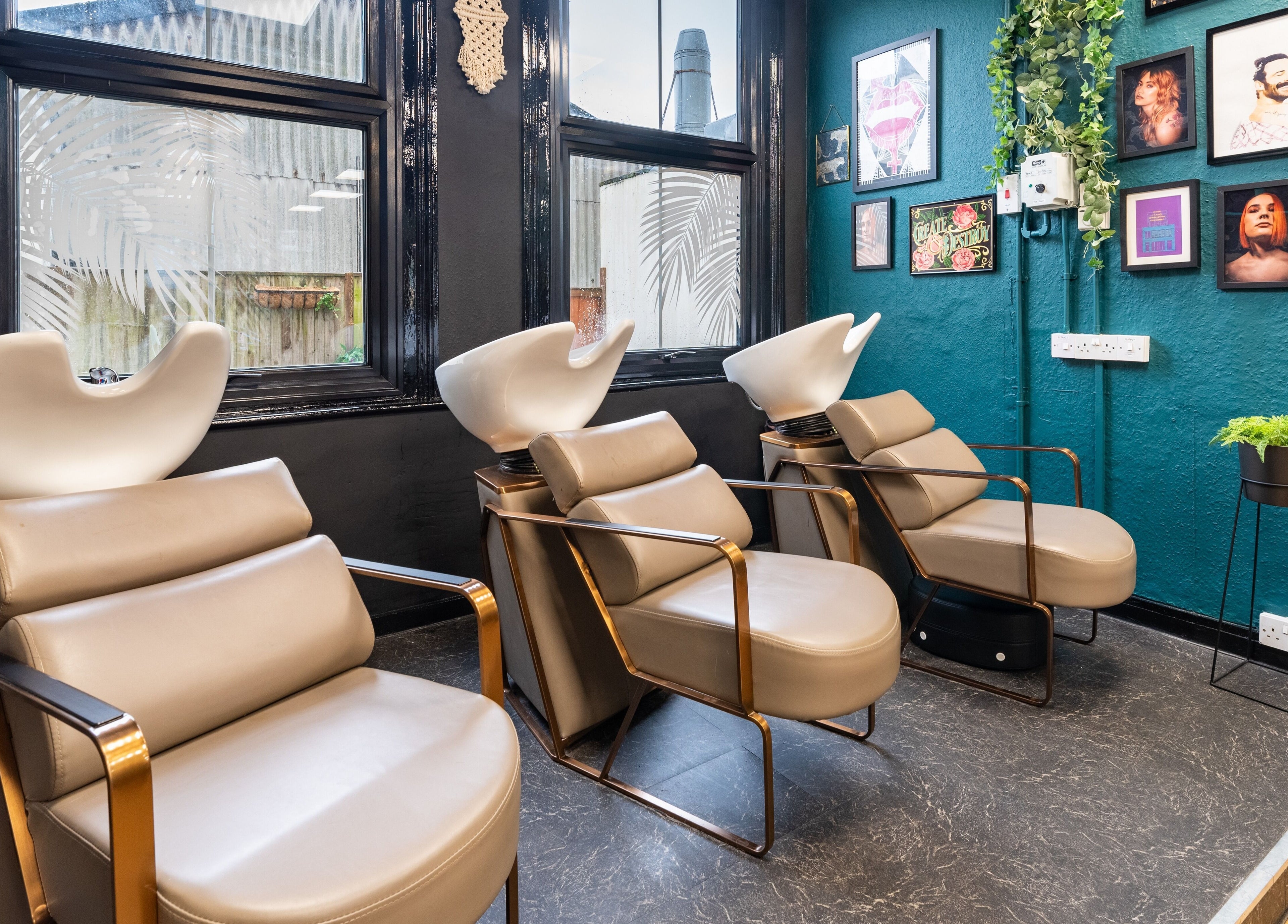 Modern salon chairs at The Knott, Folkestone, England, GB, offering a stylish and relaxing hair washing experience.