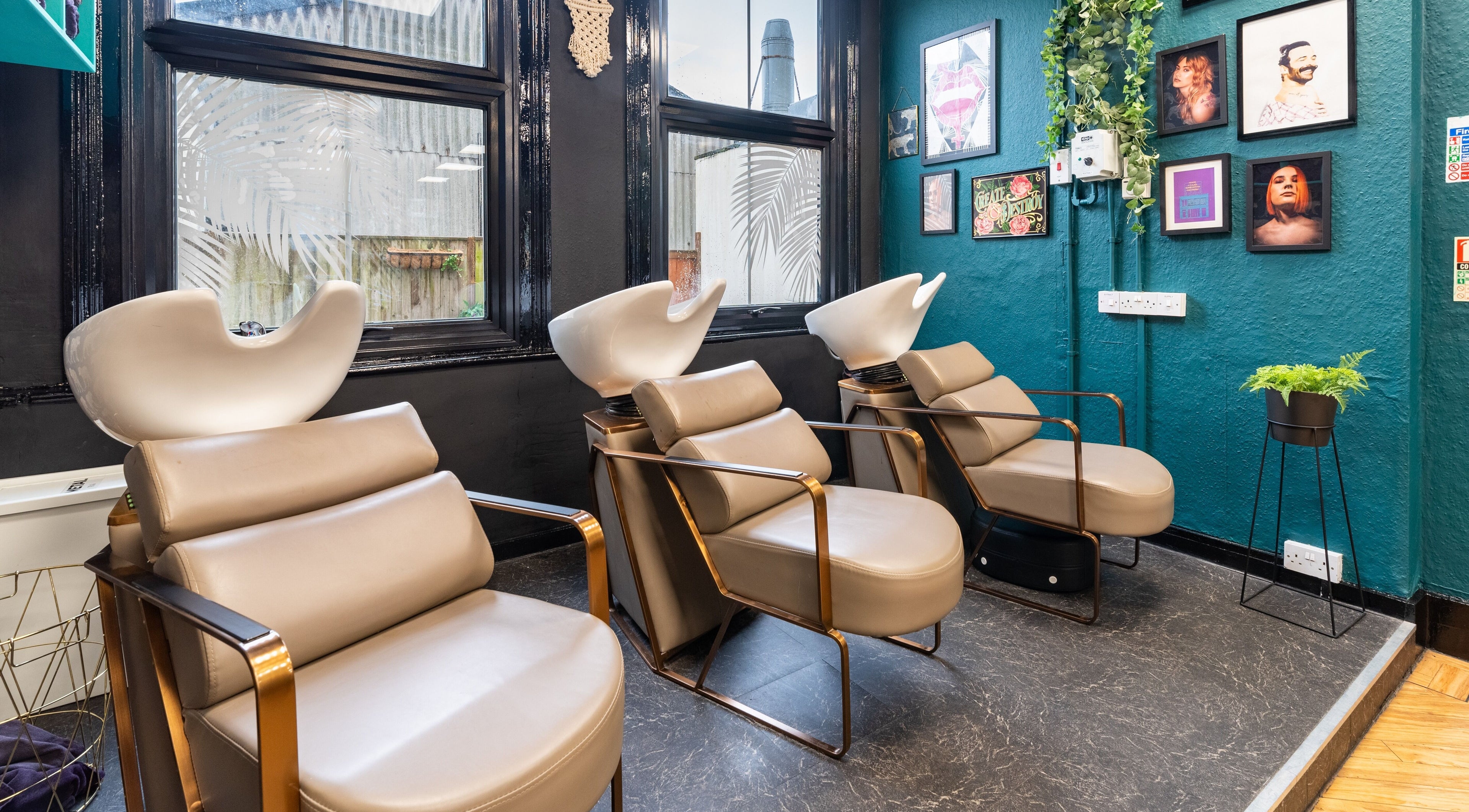 Modern salon chairs at The Knott, Folkestone, England, GB, offering a stylish and relaxing hair washing experience.