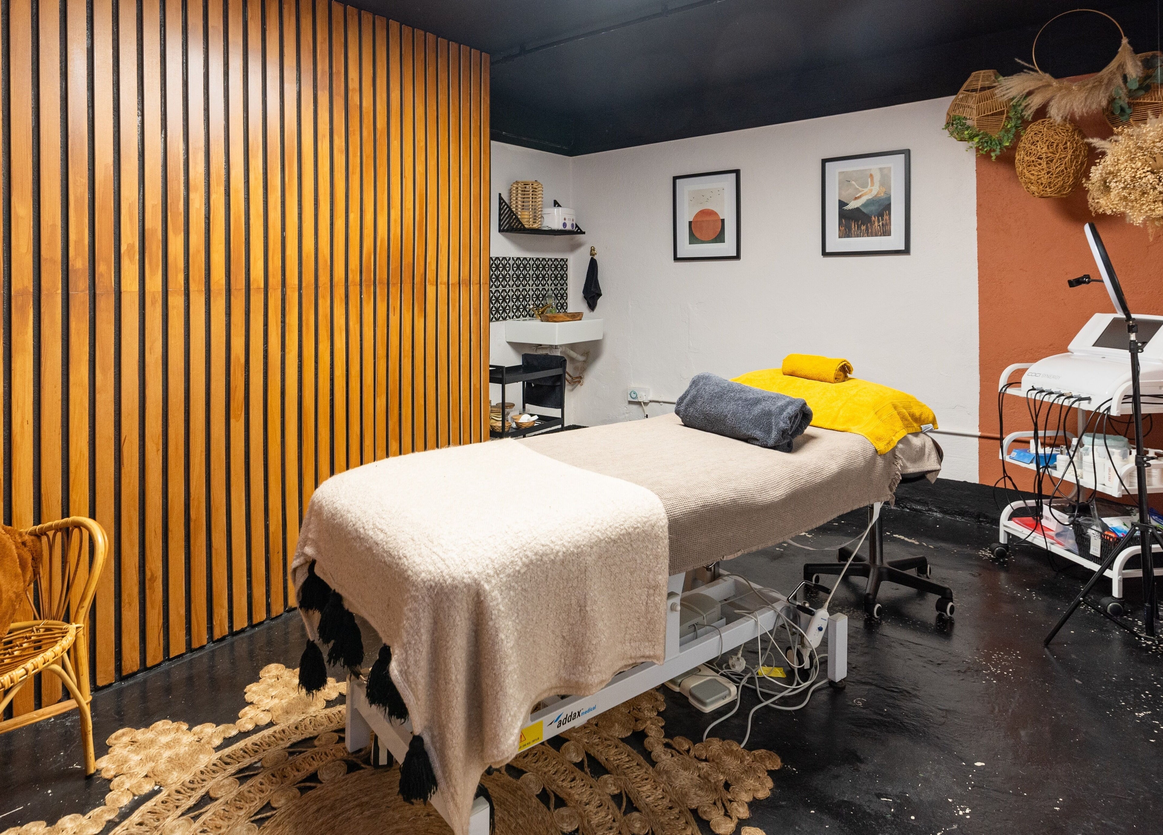 Cozy spa room at The Knott, Folkestone, England, GB with a massage bed and elegant decor.