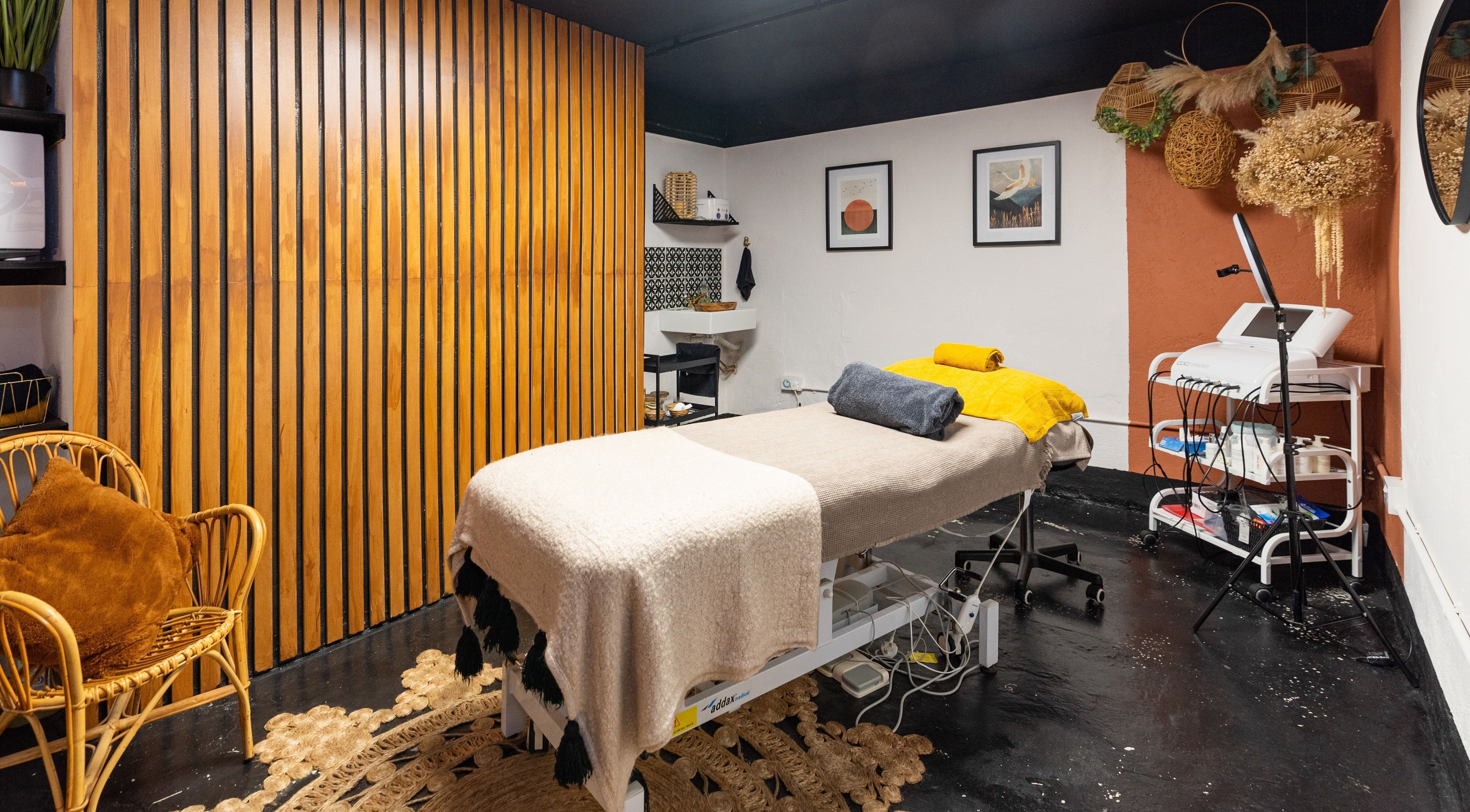 Cozy spa room at The Knott, Folkestone, England, GB with a massage bed and elegant decor.