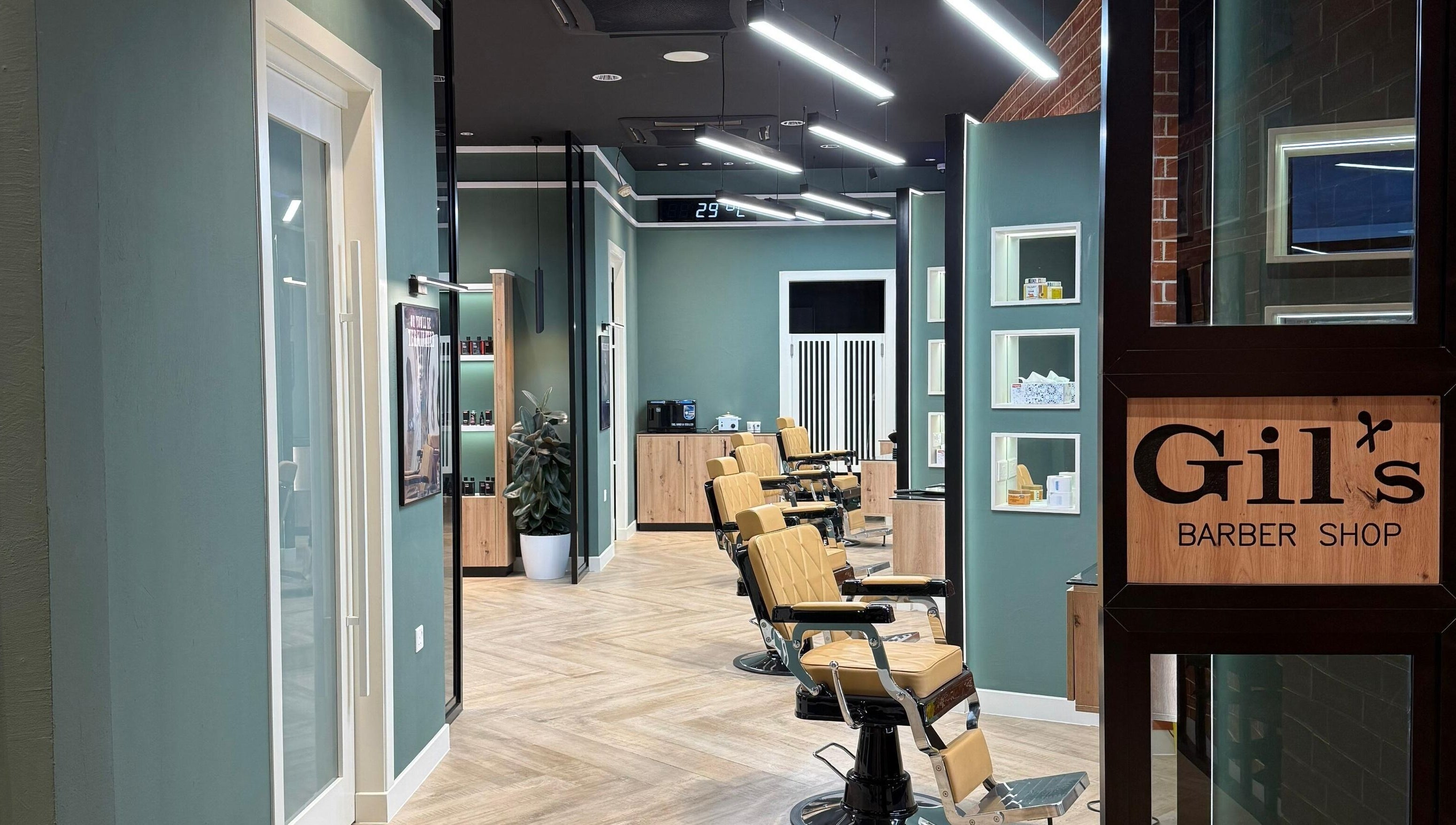 Interior of Gil’s Barbershop in Al Khobar, Eastern Province, SA, showcasing modern barber chairs and sleek decor.