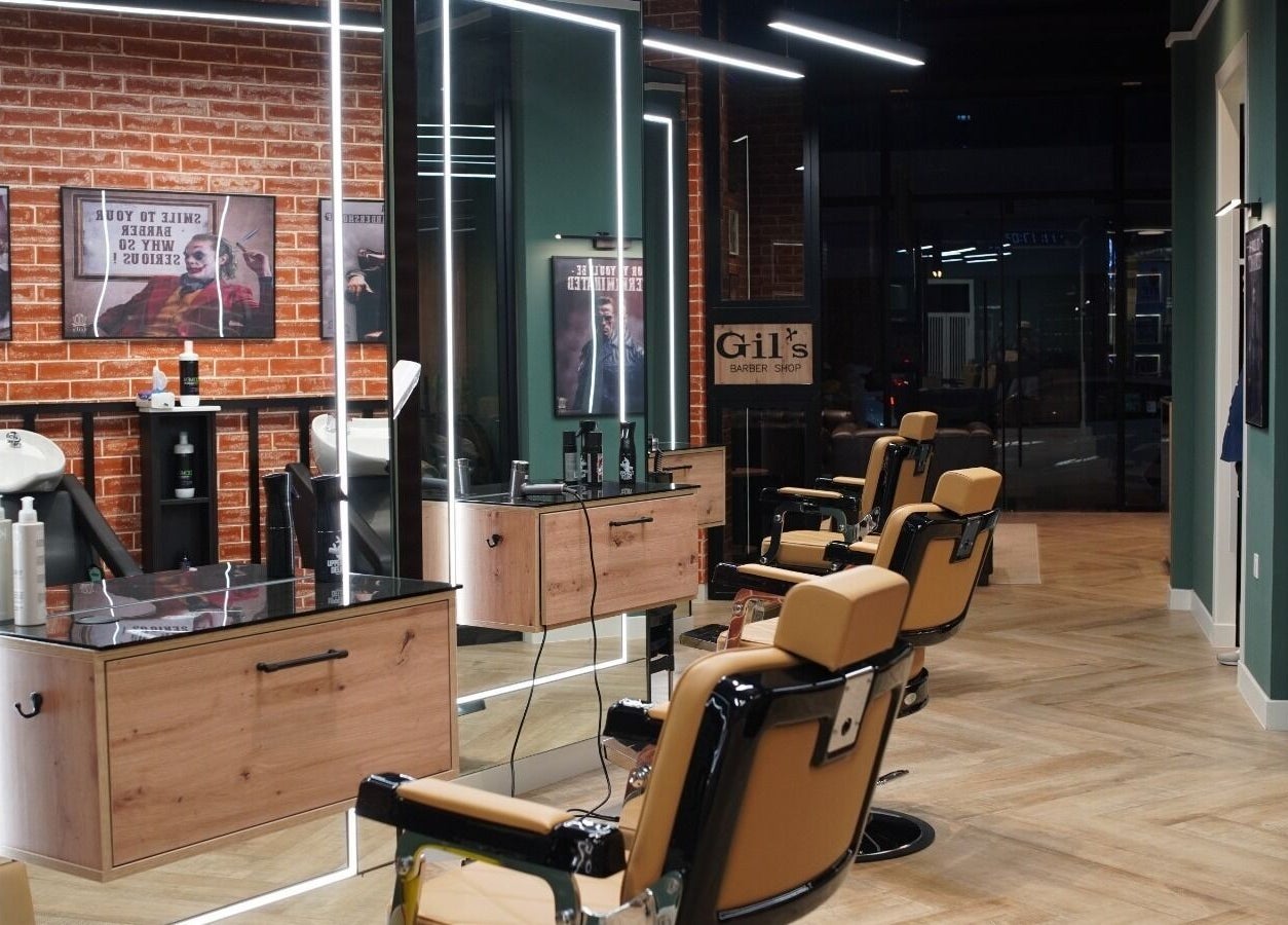 Interior view of Gil’s Barbershop in Al Khobar, Eastern Province, SA with modern barber chairs and styling stations.