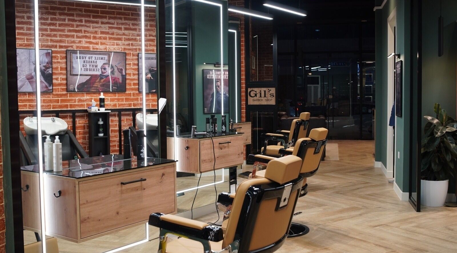 Interior view of Gil’s Barbershop in Al Khobar, Eastern Province, SA with modern barber chairs and styling stations.