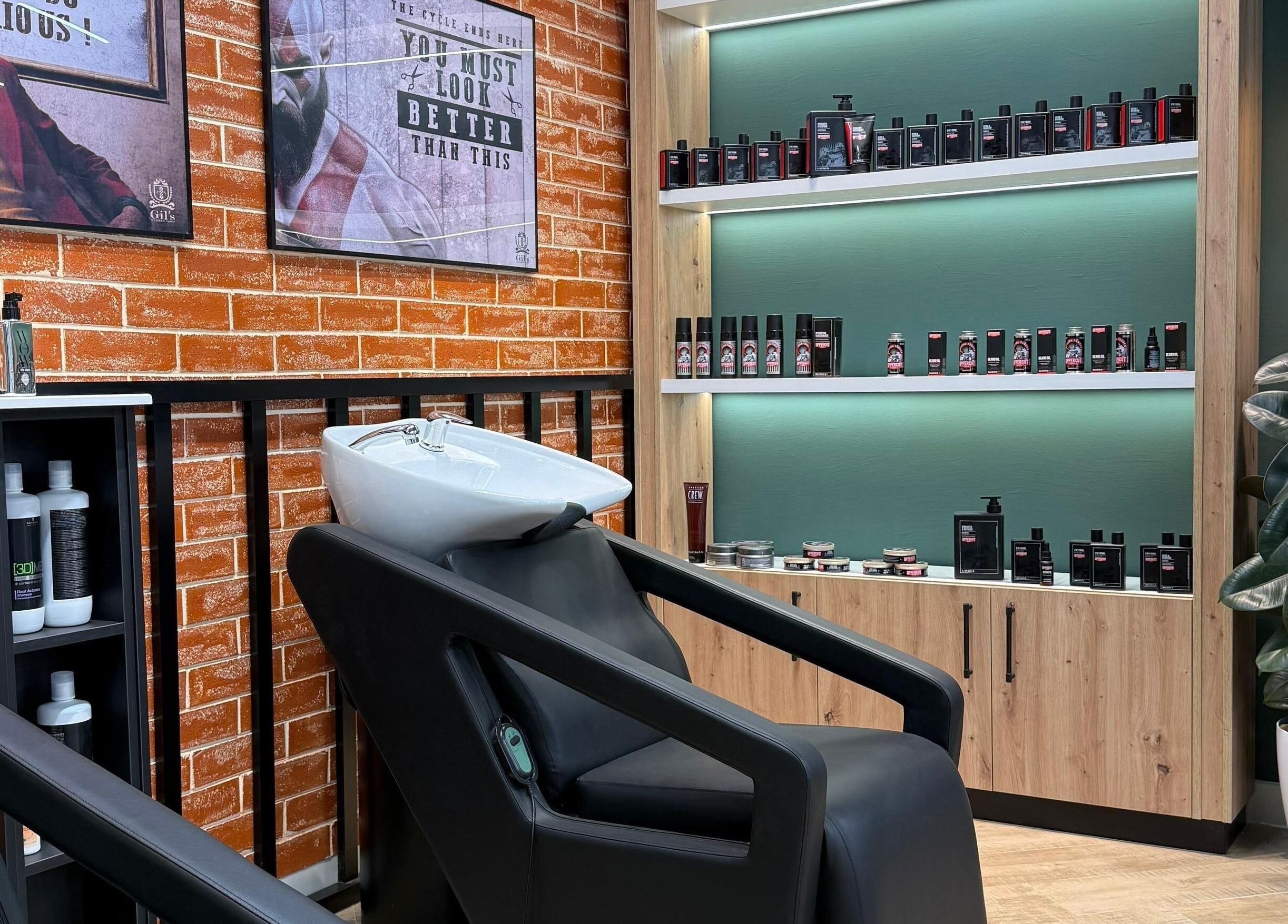 Modern shampoo station at Gil’s Barbershop, Al Khobar, Eastern Province, SA with sleek decor and products.