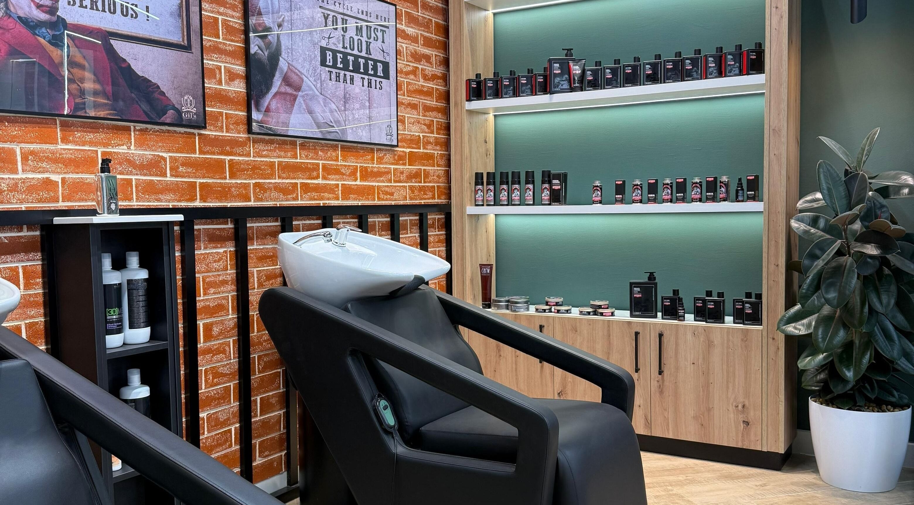 Modern shampoo station at Gil’s Barbershop, Al Khobar, Eastern Province, SA with sleek decor and products.