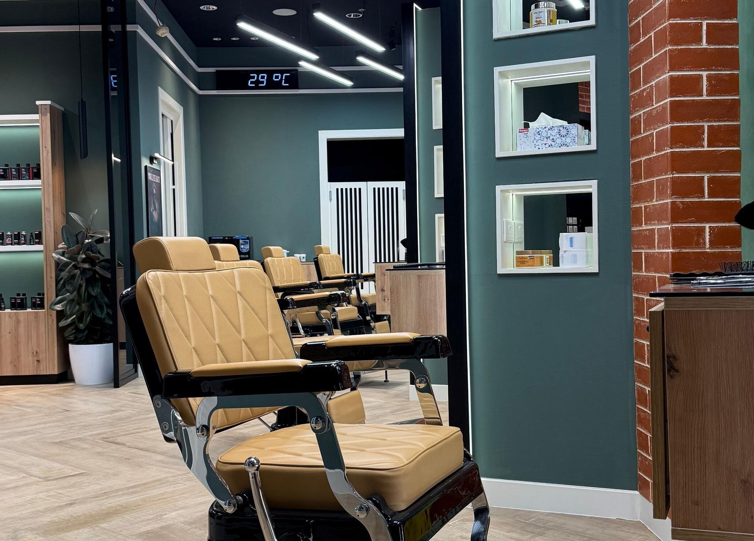 Stylish interior of Gil’s Barbershop, Al Khobar, Eastern Province, SA with modern barber chairs and decor.