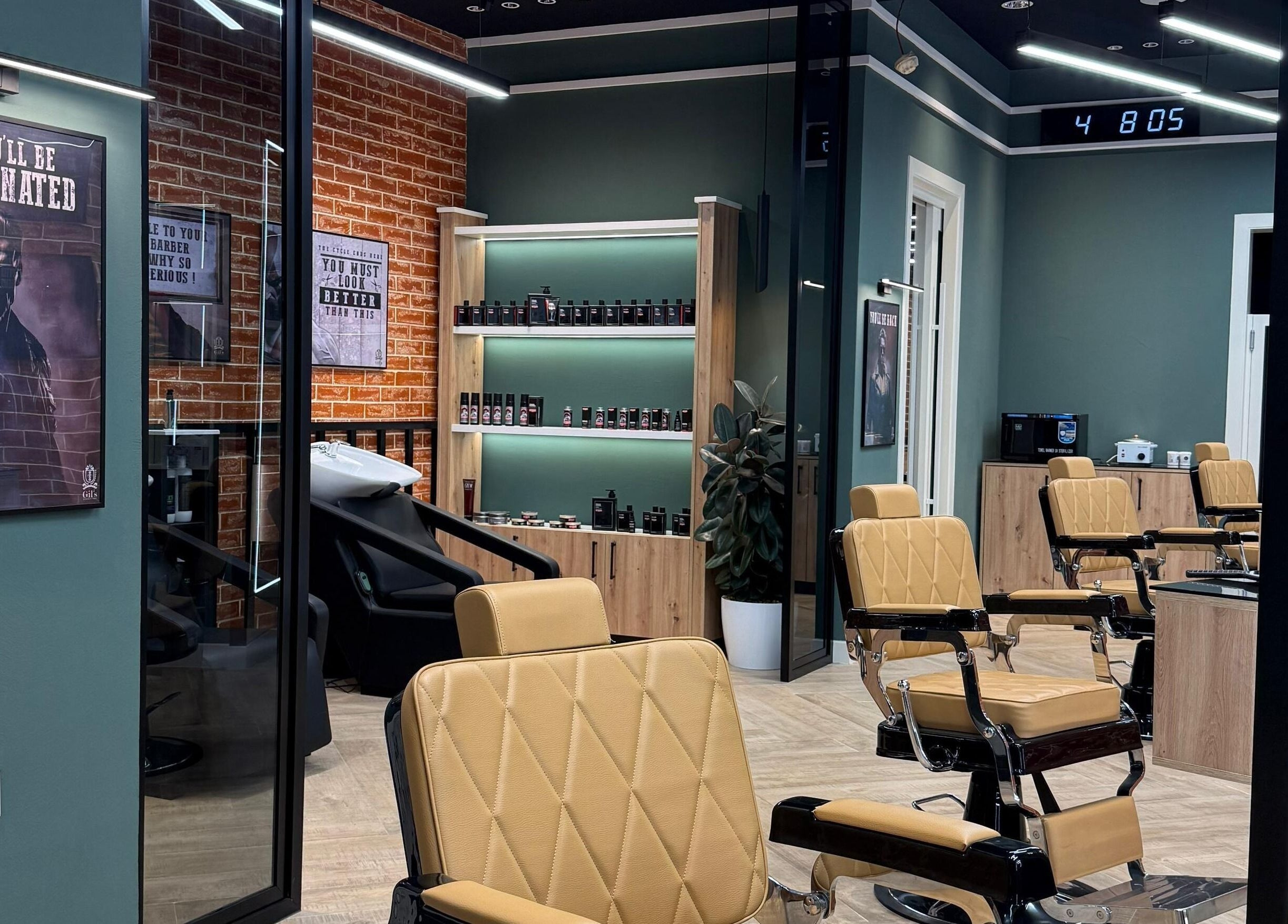Interior of Gil’s Barbershop in Al Khobar, Eastern Province, SA with stylish chairs and decor.