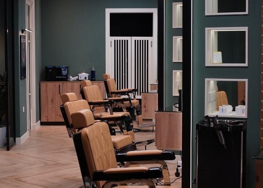 Interior of Gil’s Barbershop in Al Khobar, Eastern Province, SA featuring stylish barber chairs and modern decor.
