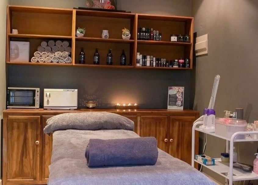 Relaxing treatment room at Skin Spa-Sandys, Lusaka, Lusaka Province, ZM, showcasing a massage table and soothing ambiance.