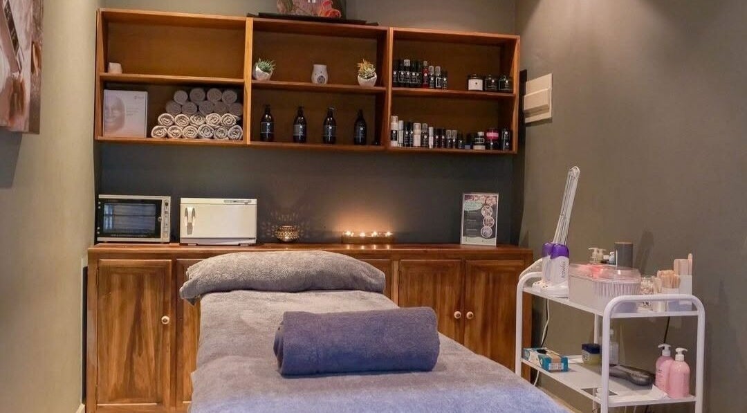 Relaxing treatment room at Skin Spa-Sandys, Lusaka, Lusaka Province, ZM, showcasing a massage table and soothing ambiance.