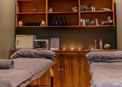 Cozy treatment room at Skin Spa-Sandys, Lusaka, Lusaka Province, ZM with massage tables and warm decor.