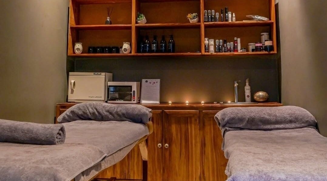 Cozy treatment room at Skin Spa-Sandys, Lusaka, Lusaka Province, ZM with massage tables and warm decor.