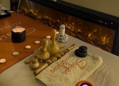 Relaxing massage tools and candle at Shospa Home Service I شوسبا خدمة منزلية, Riyadh, Riyadh Province, SA.