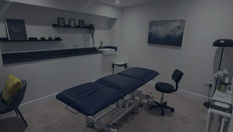 Relaxing treatment room at SkinNova Clinic, Edinburgh, Scotland, GB with plush massage table and serene decor.