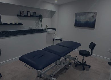 Relaxing treatment room at SkinNova Clinic, Edinburgh, Scotland, GB with plush massage table and serene decor.