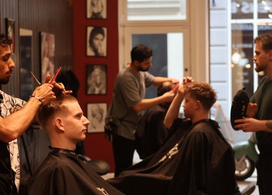 Stylists at work in Carlsens Barbershop (Svendborg • Kattesundet), Svendborg, DK. Modern haircuts in stylish interior.