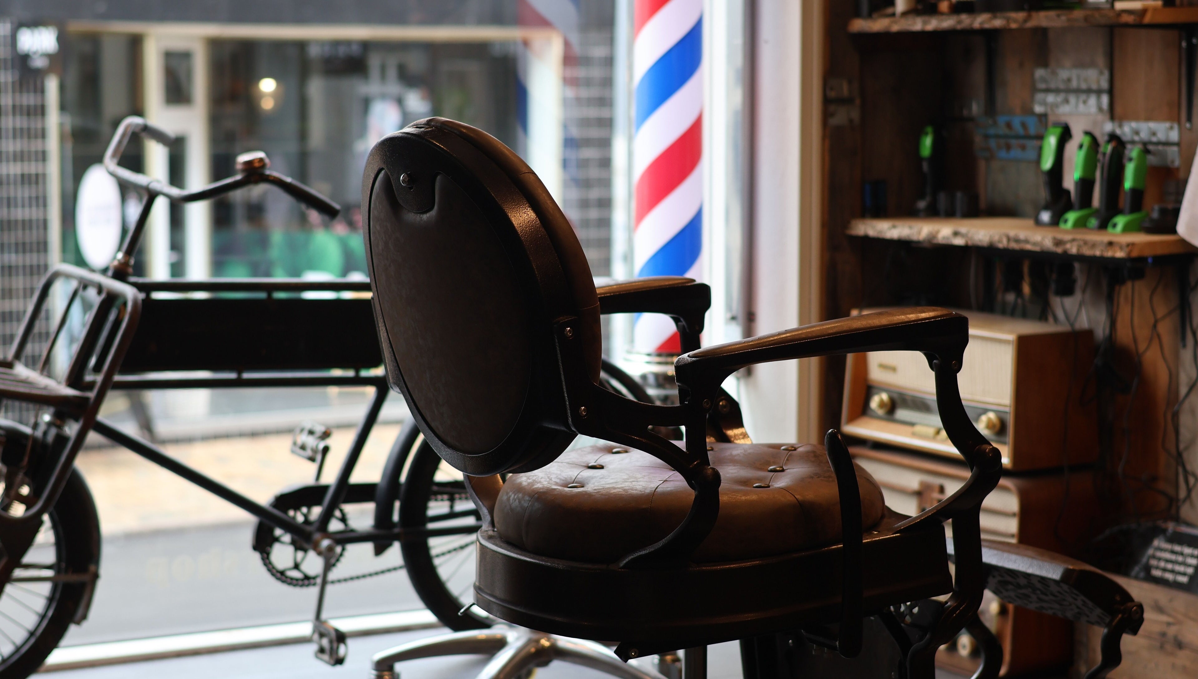 Vintage barber chair at Carlens Barbershop (Odense • Søndergade), Odense, DK showcases timeless elegance.