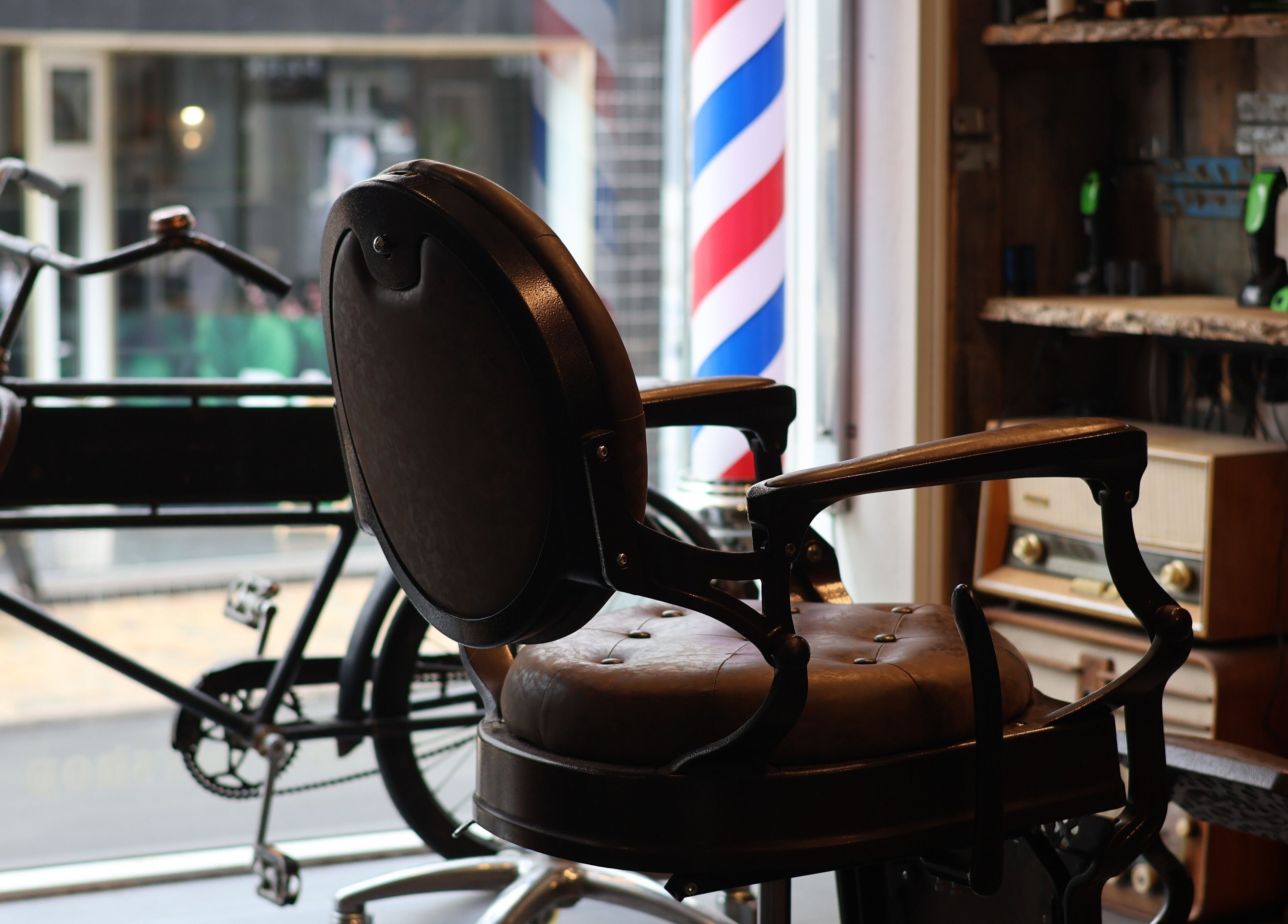 Vintage barber chair at Carlens Barbershop (Odense • Søndergade), Odense, DK showcases timeless elegance.