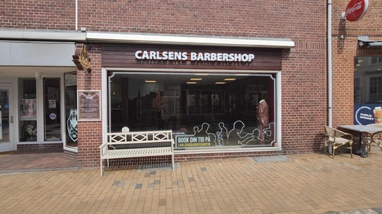 Exterior view of Carlsens Barbershop (Sønderborg • Jernbanegade) in Sønderborg, DK with stylish facade.