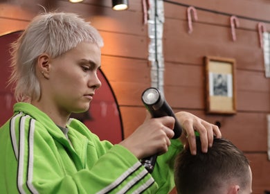 Stylist perfects haircut at Carlsens Barbershop, Aarhus • Frederiksgade, Aarhus, DK.