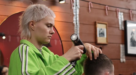 Stylist perfects haircut at Carlsens Barbershop, Aarhus • Frederiksgade, Aarhus, DK.