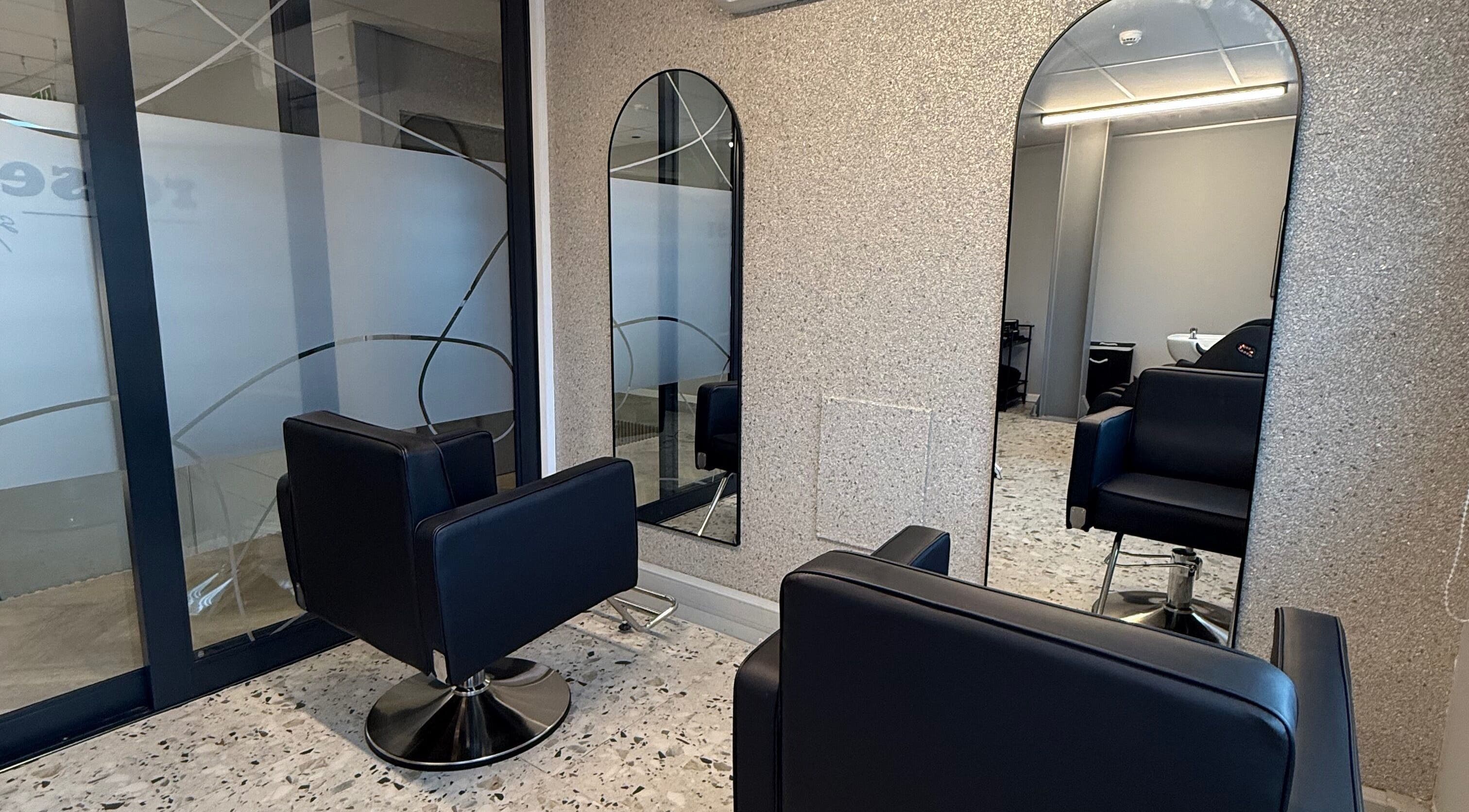 Modern salon chairs and mirrors at re.set studio, Mount Edgecombe, Kwazulu-natal, ZA.