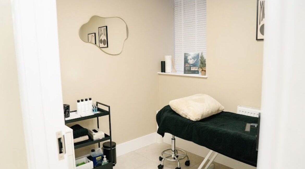Calm treatment room at PureSkin Studio, Maidstone, England, GB. Features a cozy bed and beauty essentials.