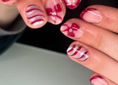 Artistic nail design at Beauty by Chloe Louise in Castlewellan, Northern Ireland, GB showcases red accents.