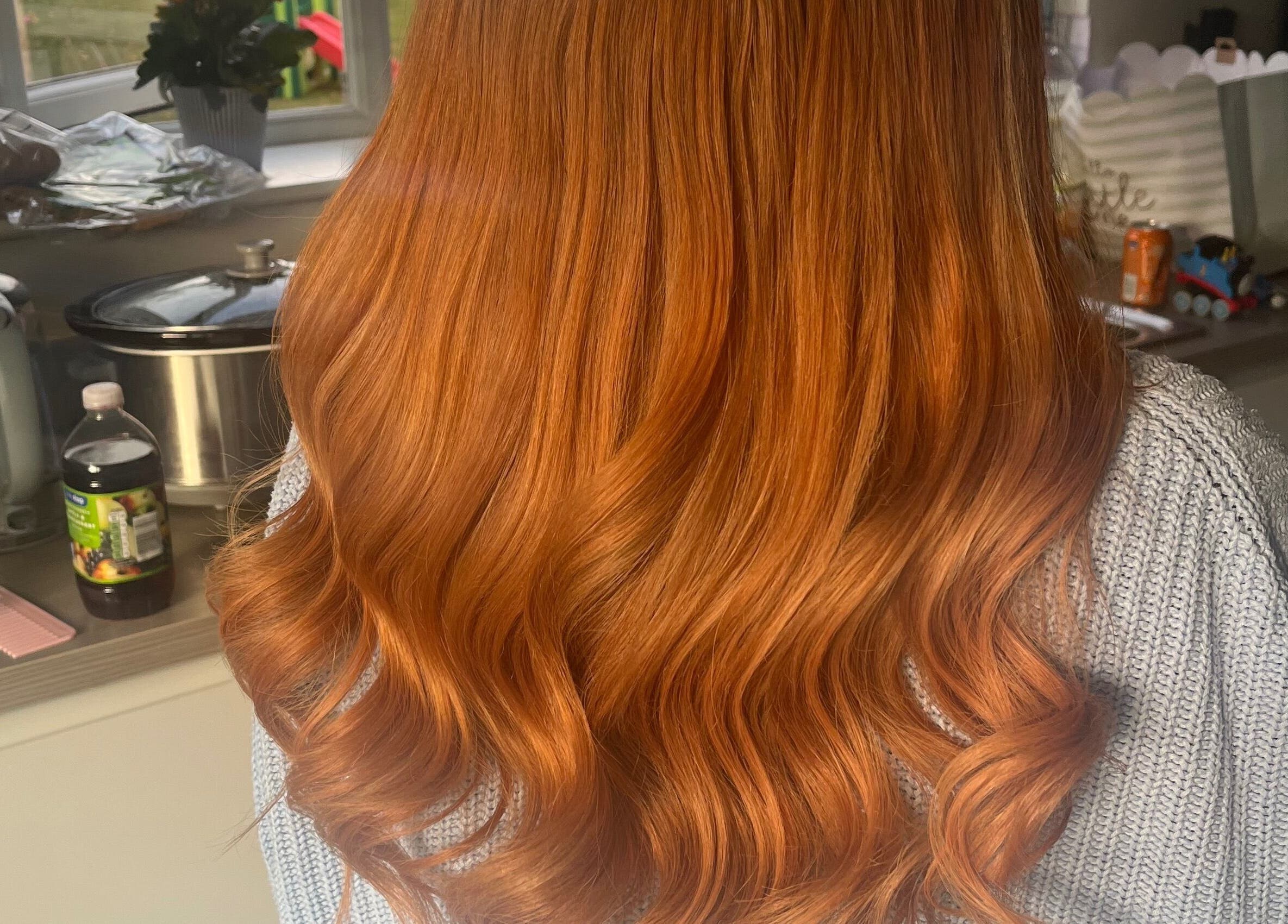 Stunning red hair waves at Emmys Extensions, Garforth, England, GB showcasing expert styling.