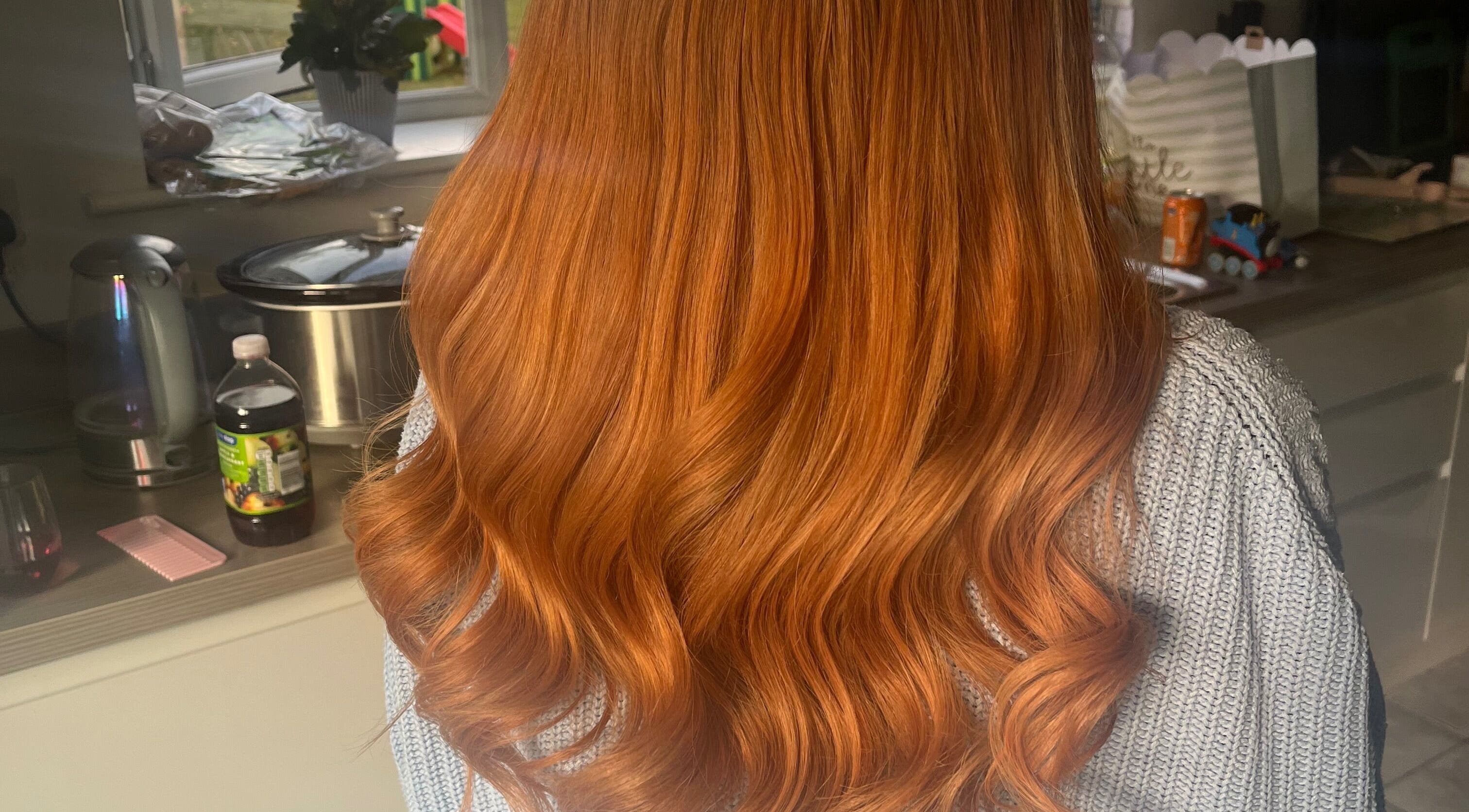 Stunning red hair waves at Emmys Extensions, Garforth, England, GB showcasing expert styling.