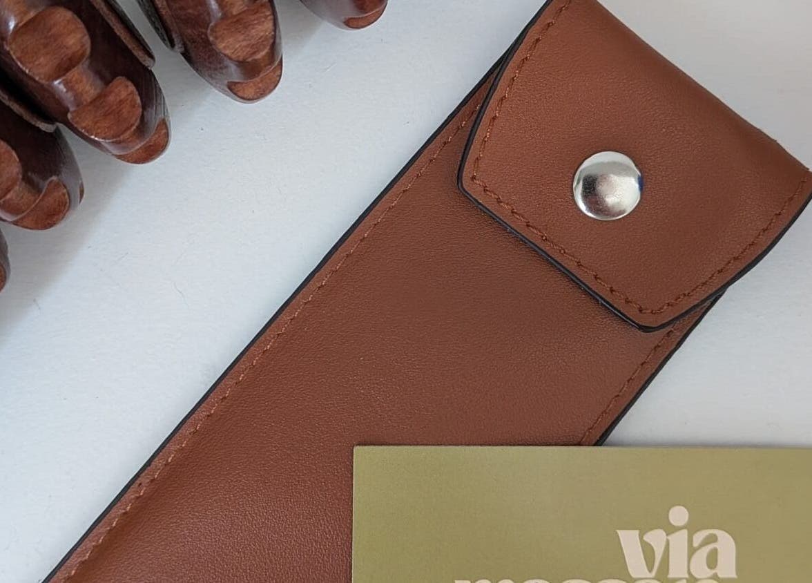 Massage tools with a leather pouch and Via Massaje card in London, England, GB.