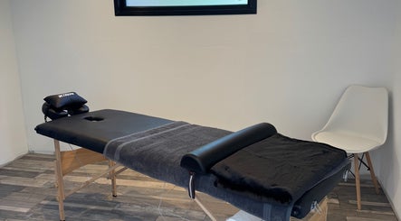 Massage table at NG Sports Massage Ballyclare in Doagh, Northern Ireland, GB, offering a tranquil ambiance.