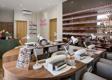 Nail Lesss salon in Bali offers chic nail care with a modern setup and vibrant polish display.