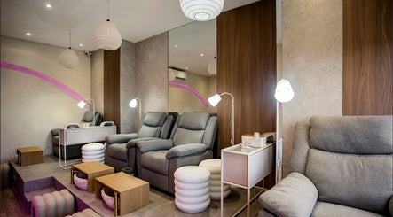 Relaxing modern spa chairs at Nail Lesss, Bali, Bali, ID with elegant lighting and cozy decor.