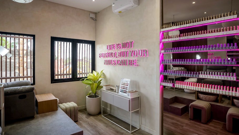 Stylish interior of Nail Lesss Monkey Forest in Bali, Bali, ID, featuring nail polish display and cozy seating.