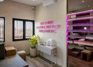 Stylish interior of Nail Lesss Monkey Forest in Bali, Bali, ID, featuring nail polish display and cozy seating.