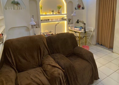 Relax in plush chairs at Nail Lesss Sugriwa, Bali, Bali, ID, a serene beauty haven with ambient lighting.