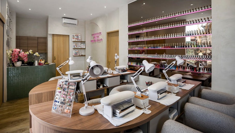 Bright interior of Nail Lesss Canggu in Bali, Bali, ID showcasing elegant nail stations and polish displays.