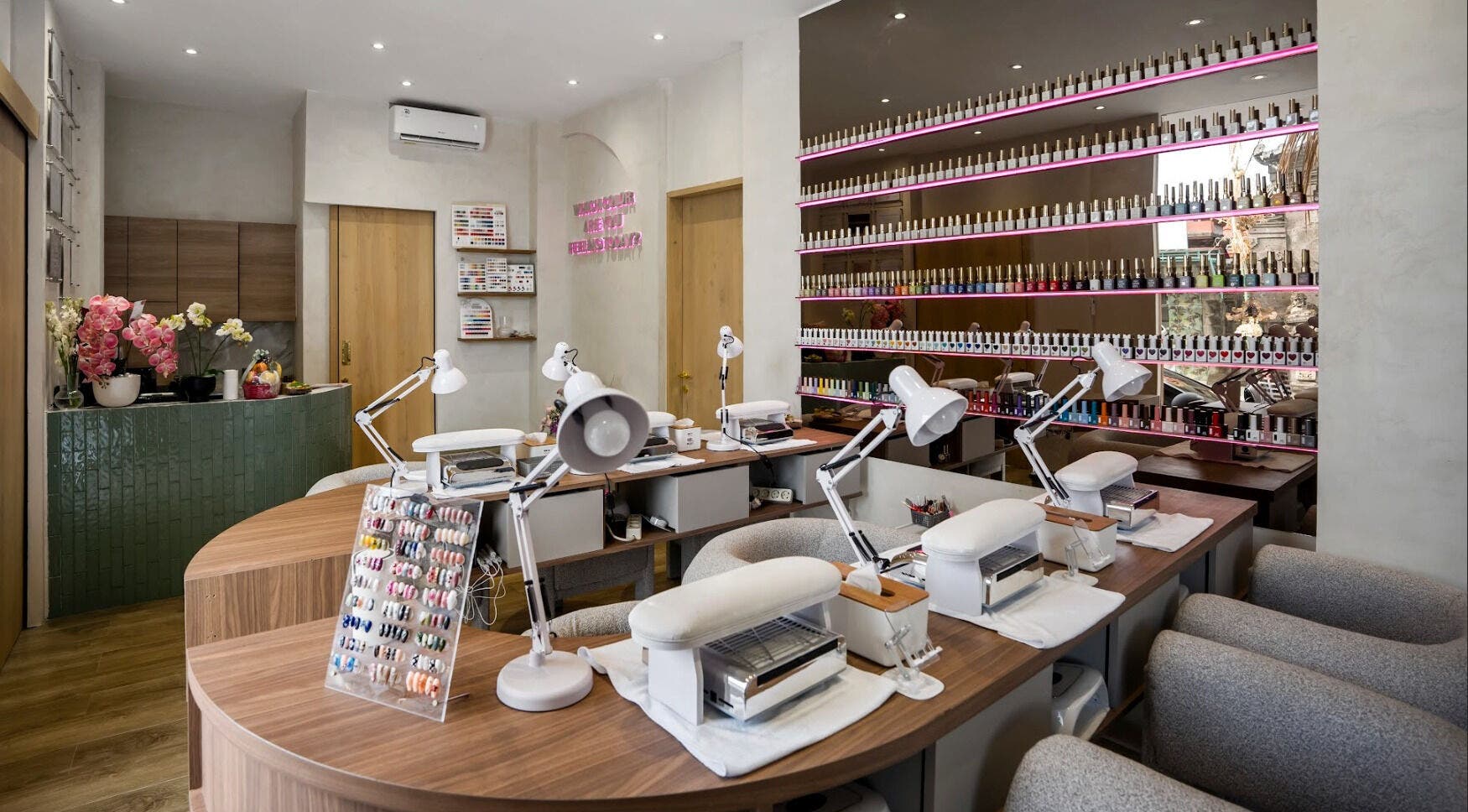 Bright interior of Nail Lesss Canggu in Bali, Bali, ID showcasing elegant nail stations and polish displays.