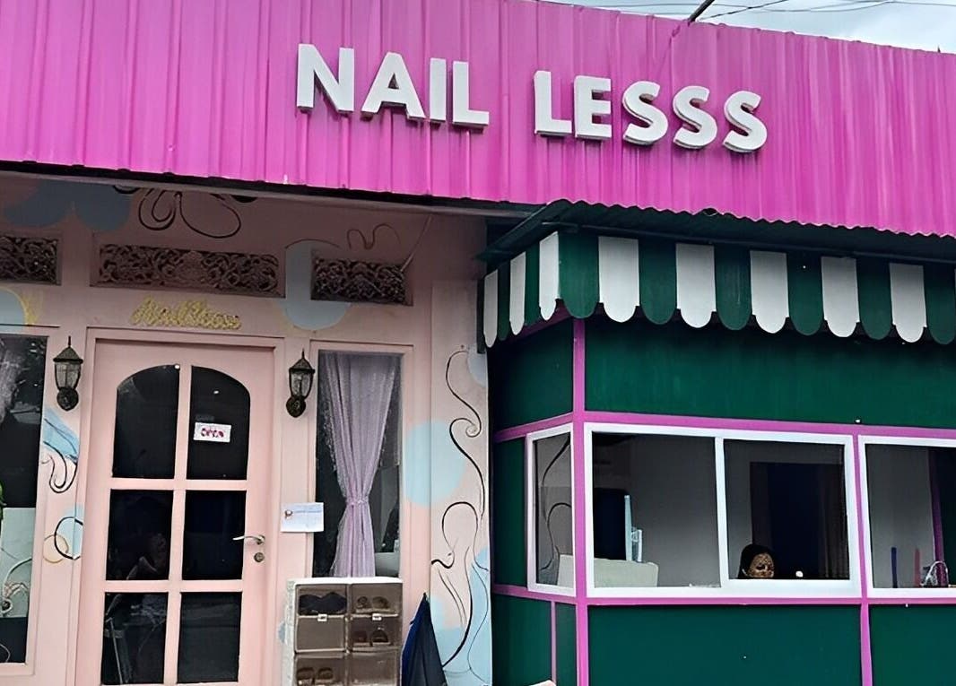 Front view of Nail Lesss Sugriwa salon with pink facade in Bali, Bali, ID.