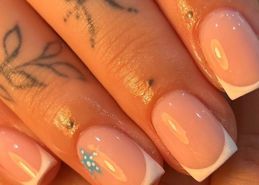 French manicure with nail art at By Jess Ellis, Birkenhead, England, GB. Perfect for stylish nails.