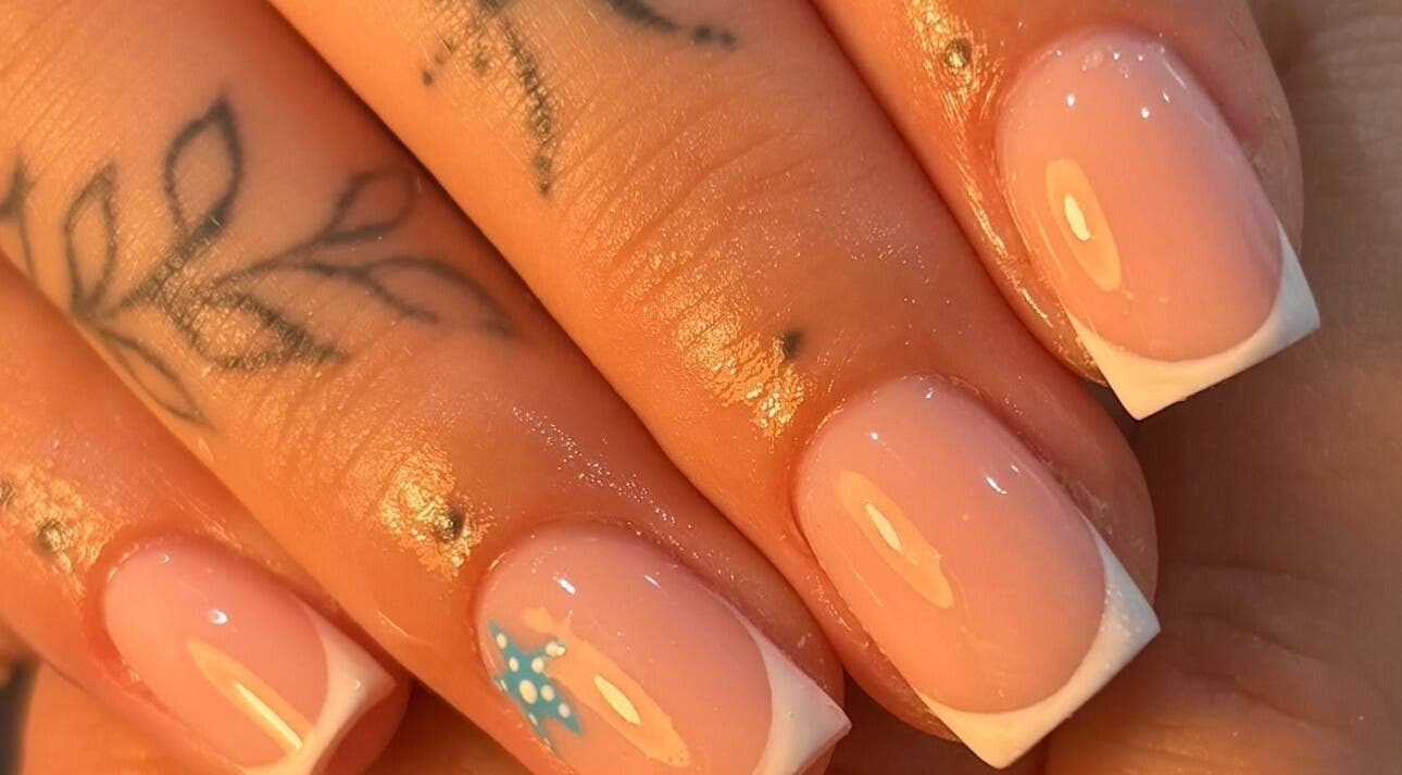 French manicure with nail art at By Jess Ellis, Birkenhead, England, GB. Perfect for stylish nails.