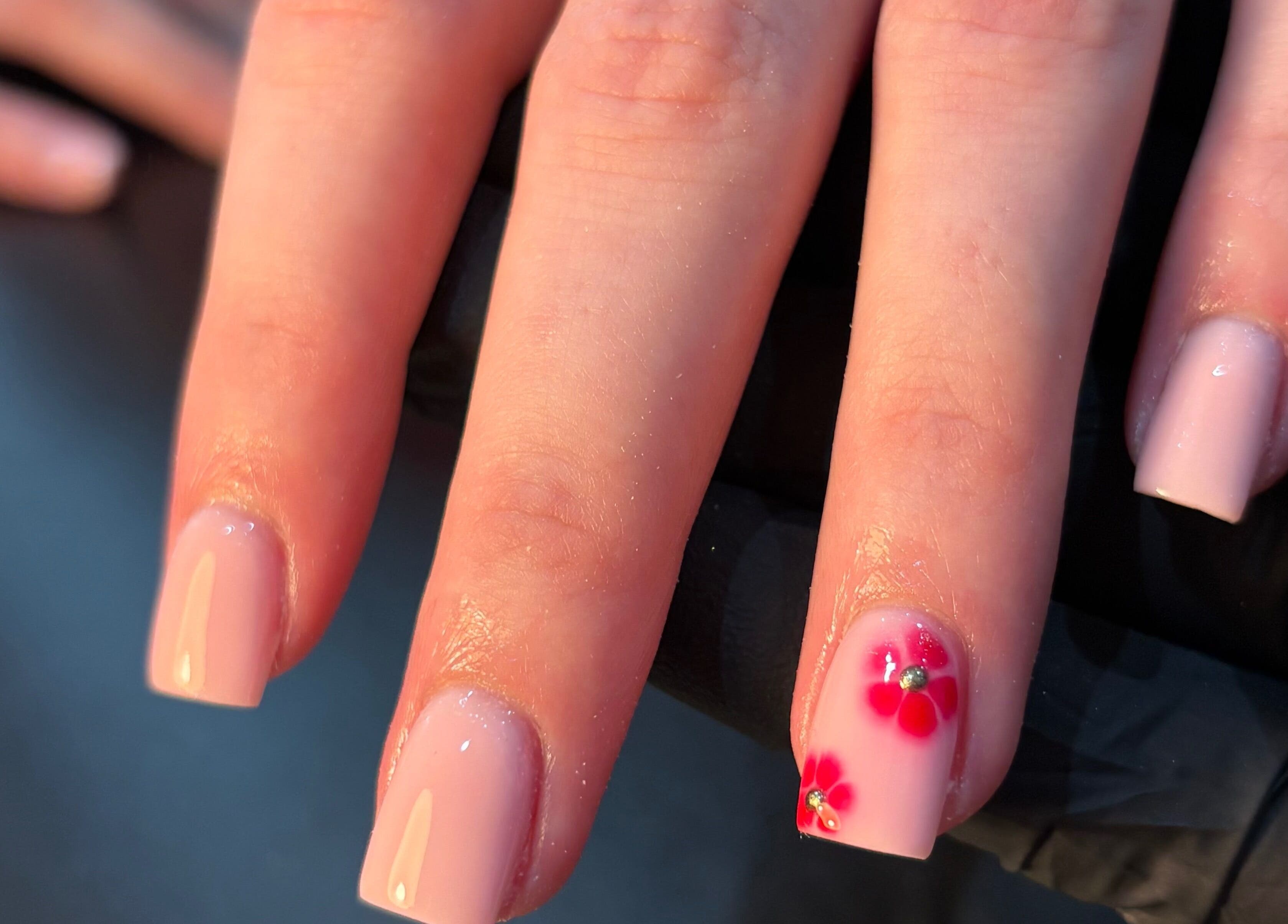 Elegant manicure with floral design by Jess Ellis in Birkenhead, England, GB.