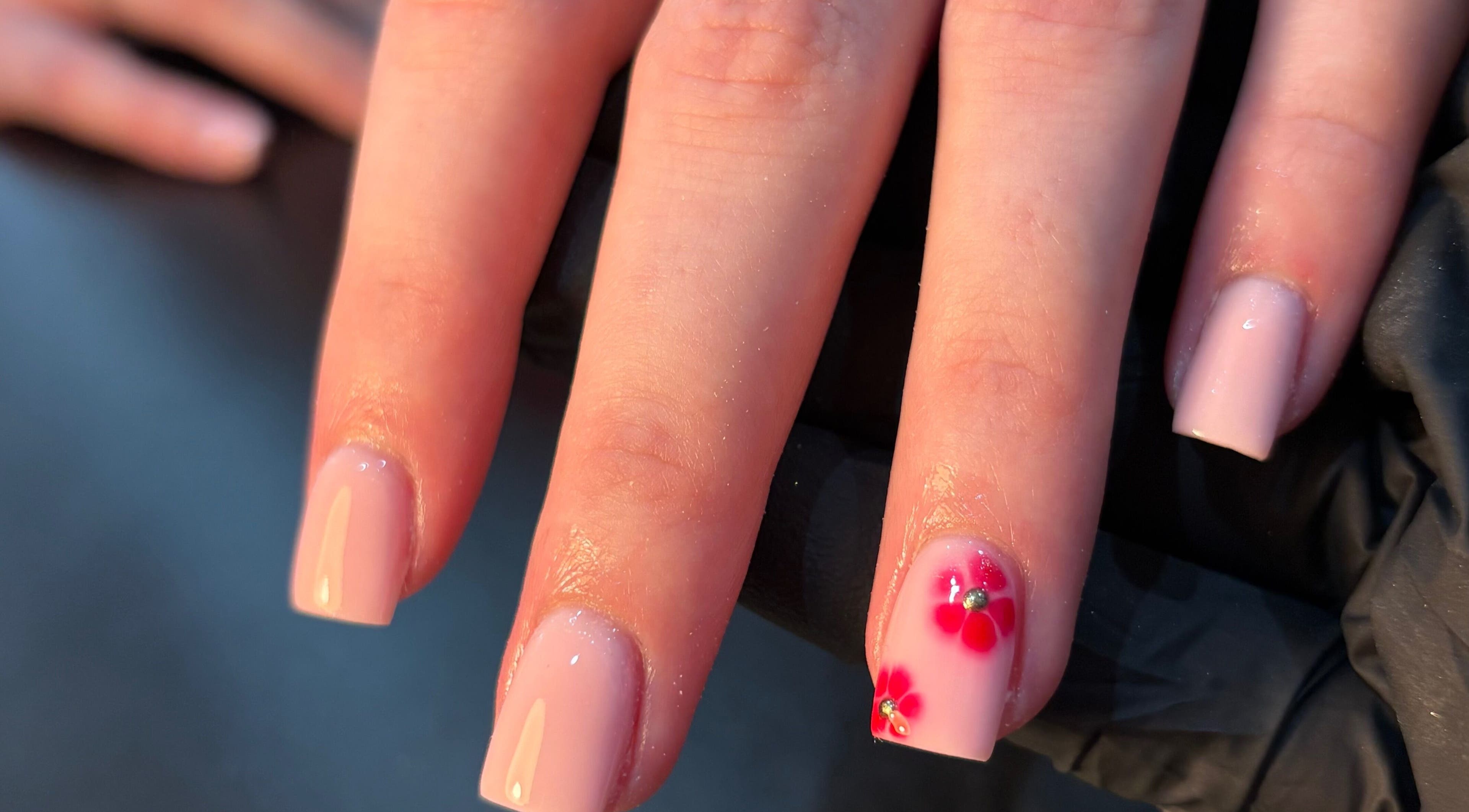 Elegant manicure with floral design by Jess Ellis in Birkenhead, England, GB.
