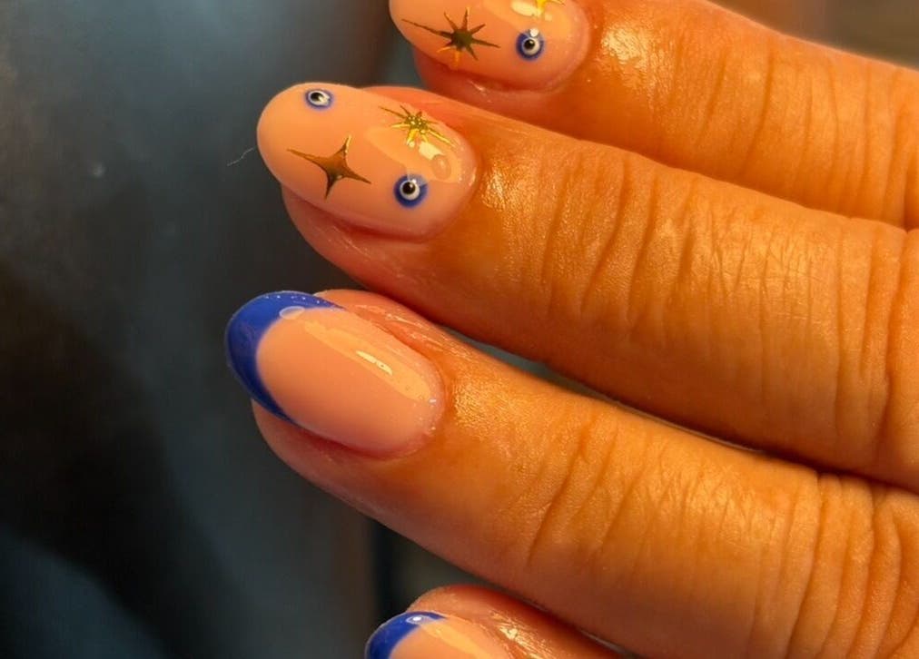 Stylish nail art showcasing celestial designs by Jess Ellis in Birkenhead, England, GB.